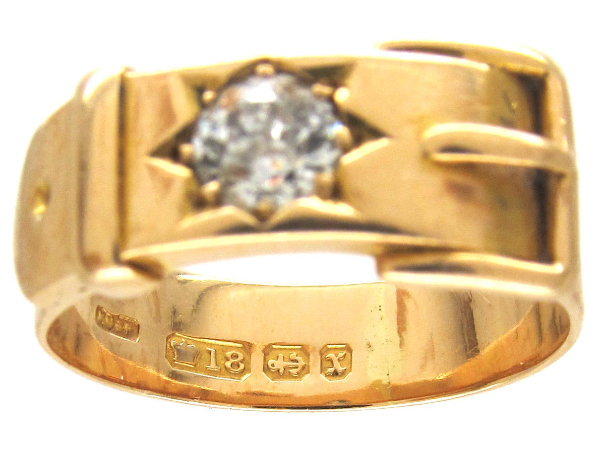 This buckle ring has a strong look. It was made in 1897 and has been set with an 80 point diamond. The belt/buckle is much like the serpent – it represents eternity, fidelity, loyalty, strength and protection. The symbol curves around and threads