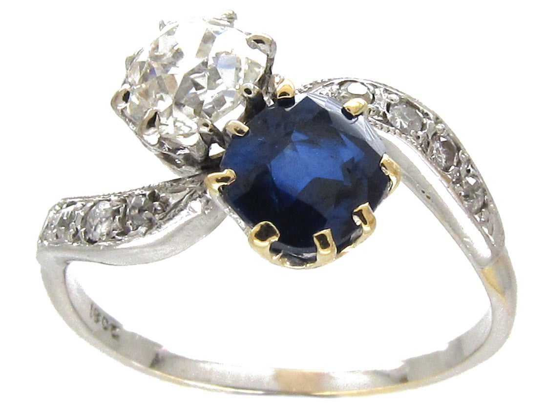 A beautiful diamond and sapphire crossover ring which would be ideal as an engagement ring. It has a platinum top with an 18ct gold shank. The stones have been well chosen for their lively colour. Rings of this quality are hard to find.