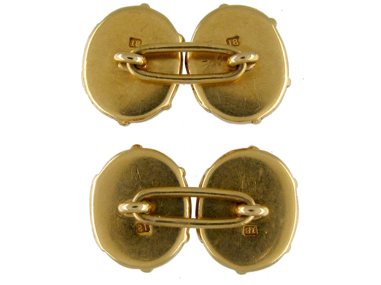 An extremely unusual pair of beautifully made locket cufflinks. Each face opens out, making four lockets in total. They are in 18 carat yellow gold and a good weight.