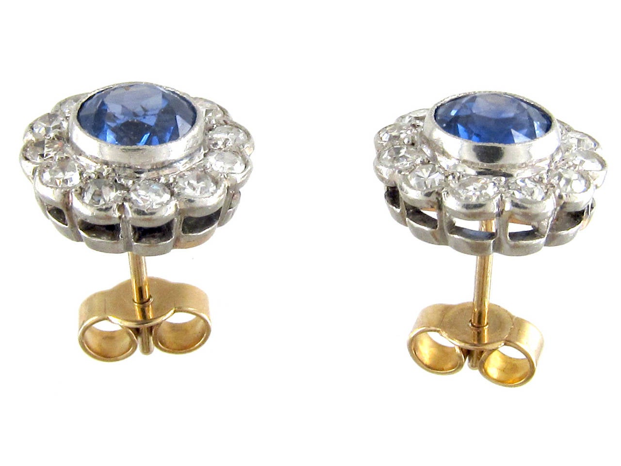 The well matched cornflower blue sapphires really make these earrings special. The diamonds are bright and the platinum work is finely executed. They were made circa 1910-1920.