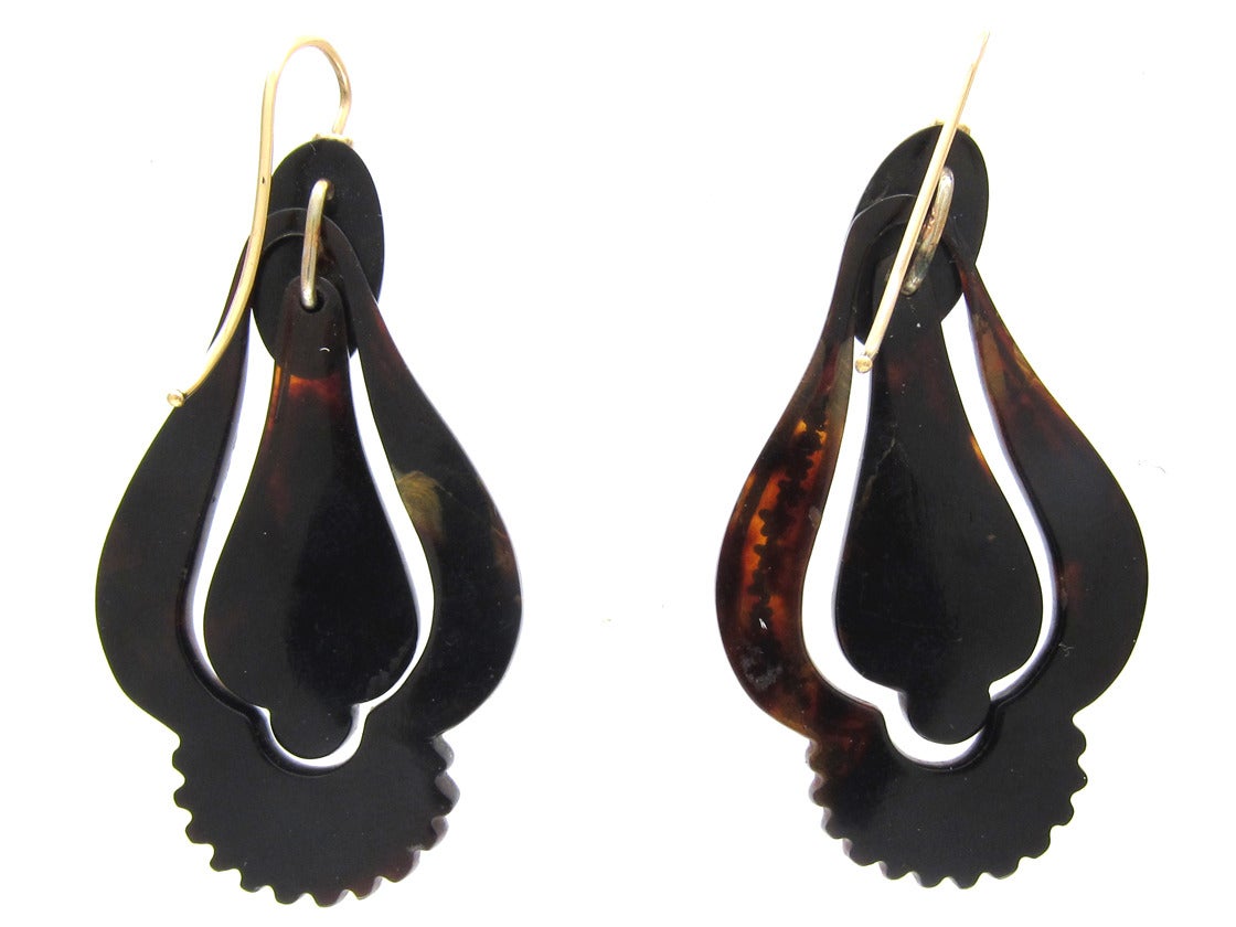 A fine pair of tortoiseshell drop earrings delicately inlaid with silver and gold flowers. This art was perfected in the Victorian era. The tortoiseshell was heated and the metals pressed in and allowed to cool under light pressure. These earrings