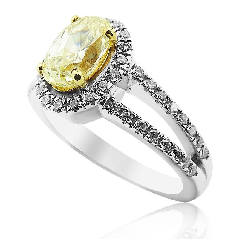 NATURAL FANCY YELLOW OVAL SHAPED DIAMOND RING 

Central oval cut fancy natural yellow diamond totaling 1.61cts


Colour grade: Natural Fancy Yellow


Clarity Grade: VS2


Surrounded by a halo of brilliant cut white diamonds leading onto a slipt