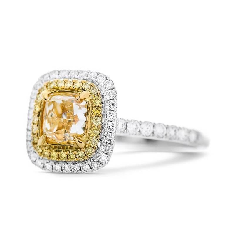 CUSHION CUT FANCY YELLOW DIAMOND RING

Set in 18Kt White Gold
Total yellow diamond weight: 1.27 ct
Color: W-X
Clarity: VS1
Mesurements: 5.99 x 5.82 x 4.01 mm

Total yellow side diamond weight: 0.10 ct

Total white side diamond weight: 0.36 ct
Color: