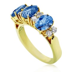 Yellow Gold Trinity with Oval Cut Sapphire and Brilliant Cut Diamonds Ring