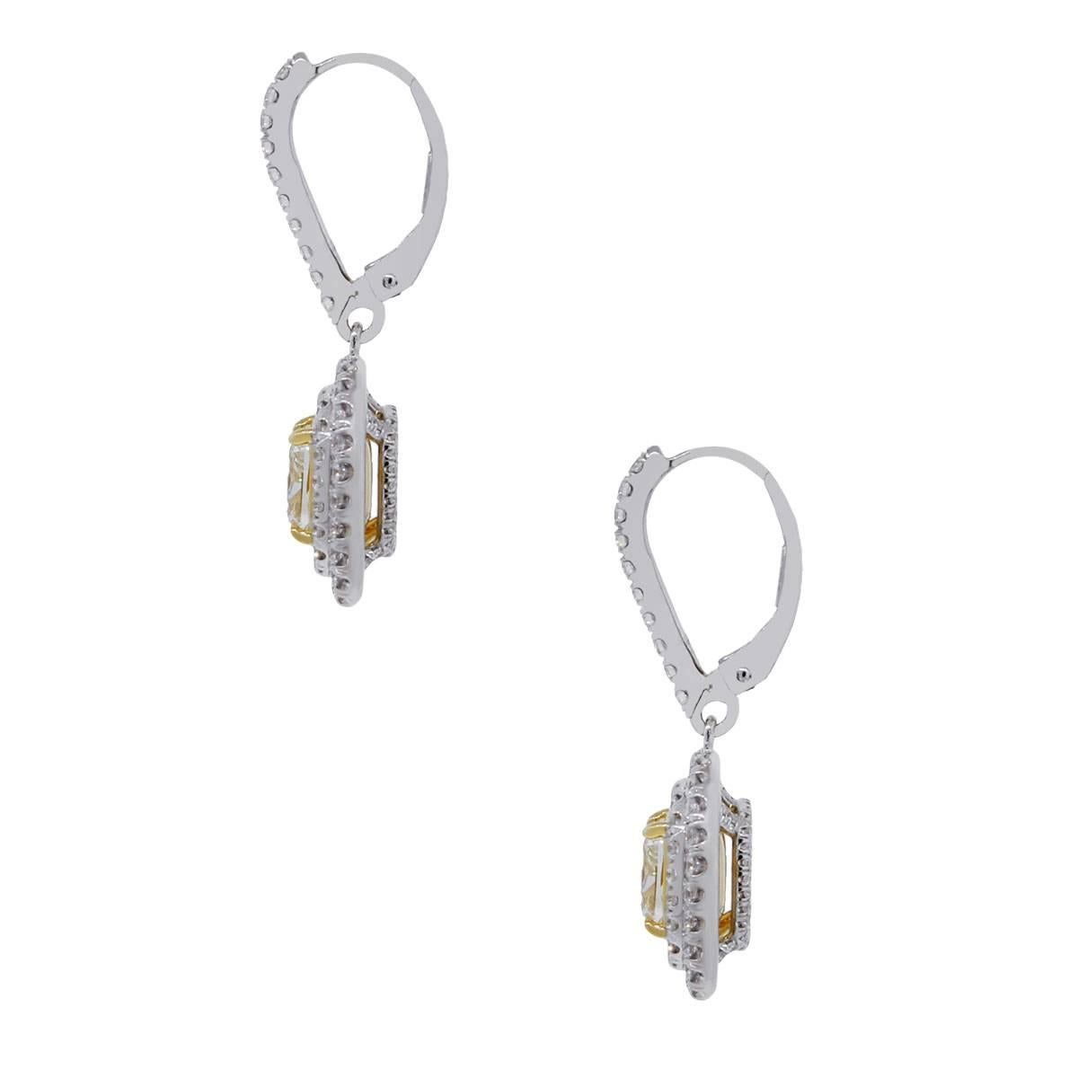 Material: 18k yellow gold and 18k white gold 
Diamond Details: 2.32 carat cushion cut diamonds that are fancy light yellow in color and VS2 in clarity. GIA Certified (6167372618) (2165676982)
Accent Diamond Details: Approximately 2.01ctw round