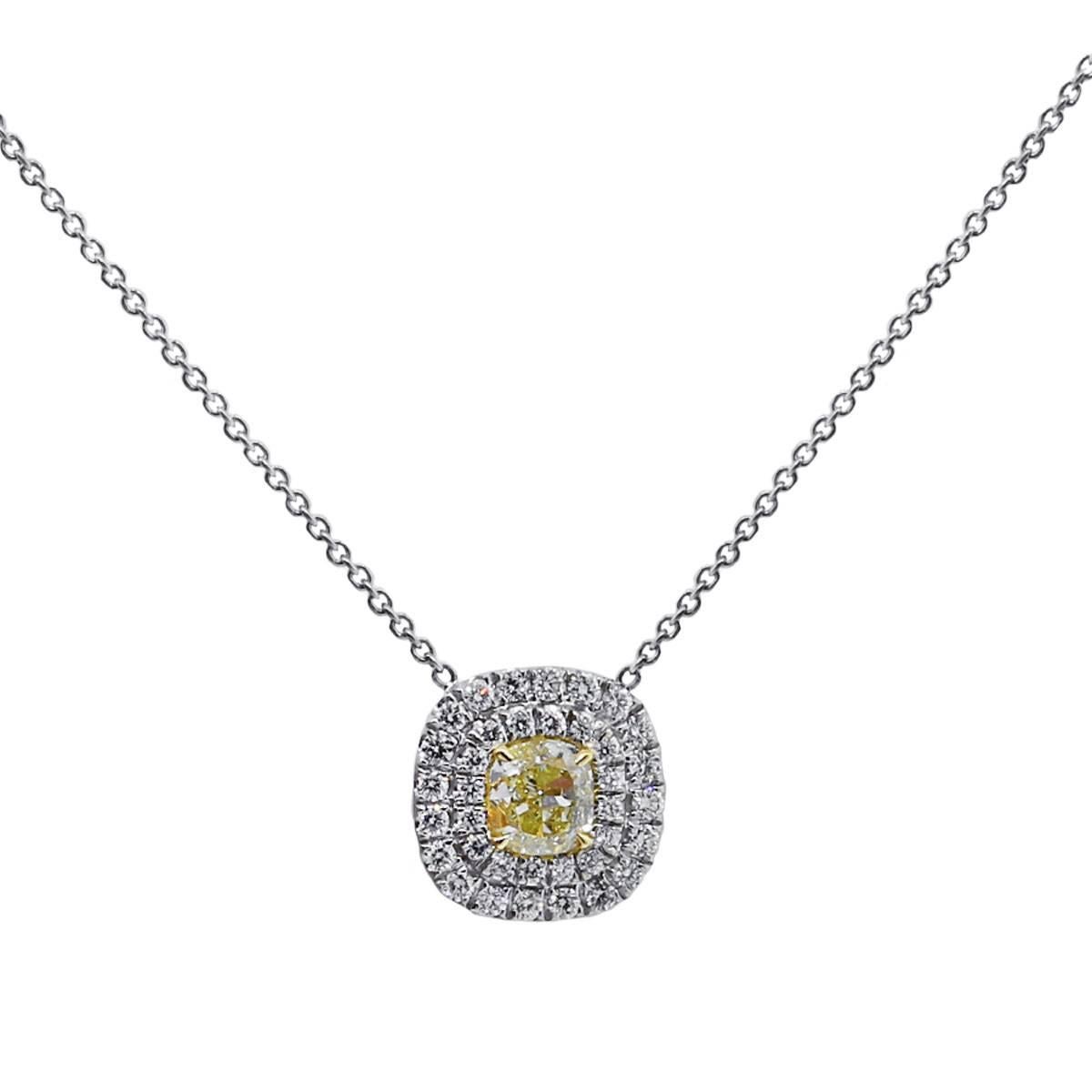 Material: 18k white/yellow gold 
Diamond Details: 1.20 carat fancy yellow cushion cut diamond. Center diamond is SI1 in clarity. GIA certified
Accent Diamonds: Approximately 0.88 round brilliant diamonds. 
Additional Details: This item comes with a