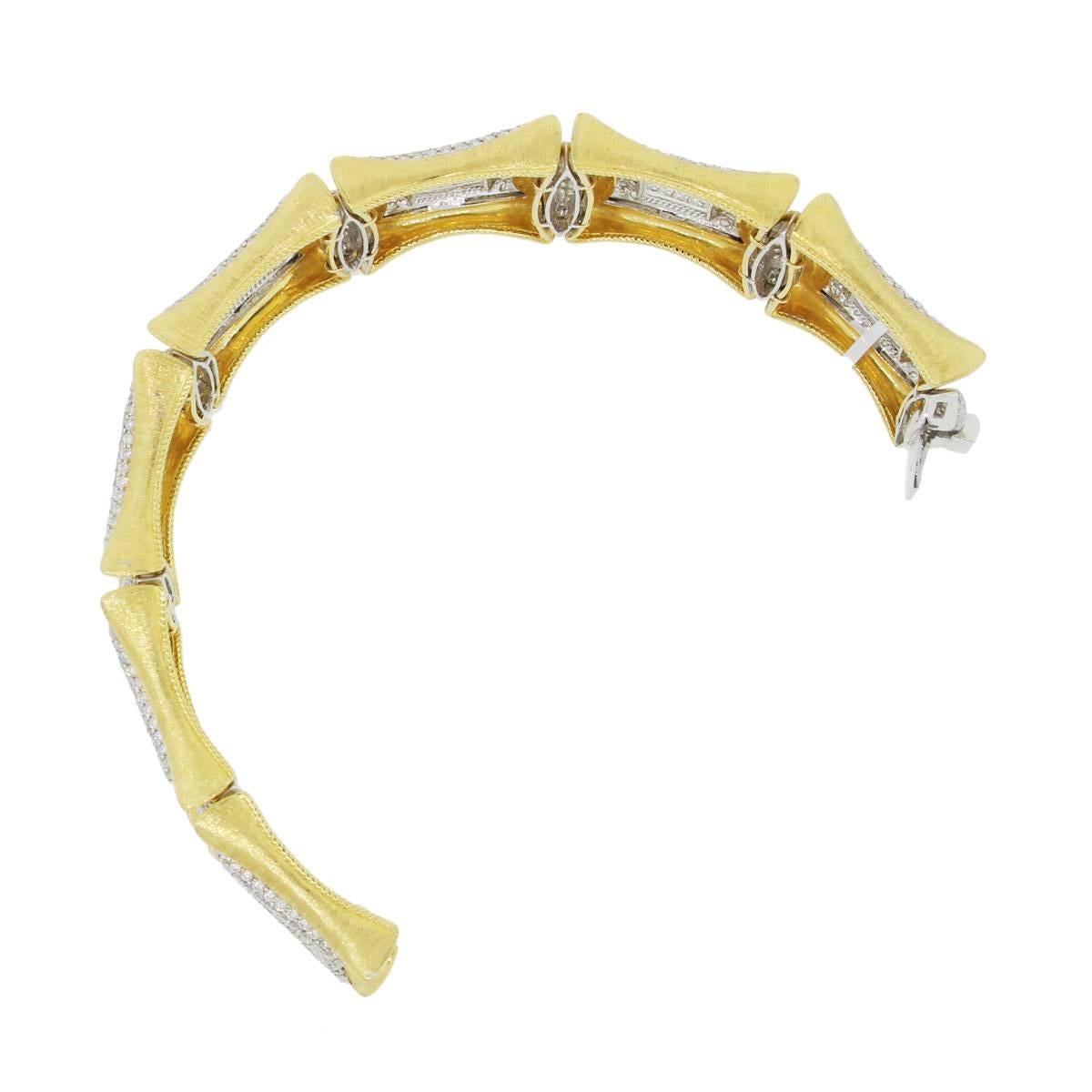 Material: 18k white and yellow gold
Diamond Details: Approximately 21.32ctw of round brilliant diamonds. Diamonds are G/H in color and VS in clarity
Bracelet Measurements: 8″ x 0.33″ x 1.25″
Clasp: Tongue in box with safety latch
Total Weight: