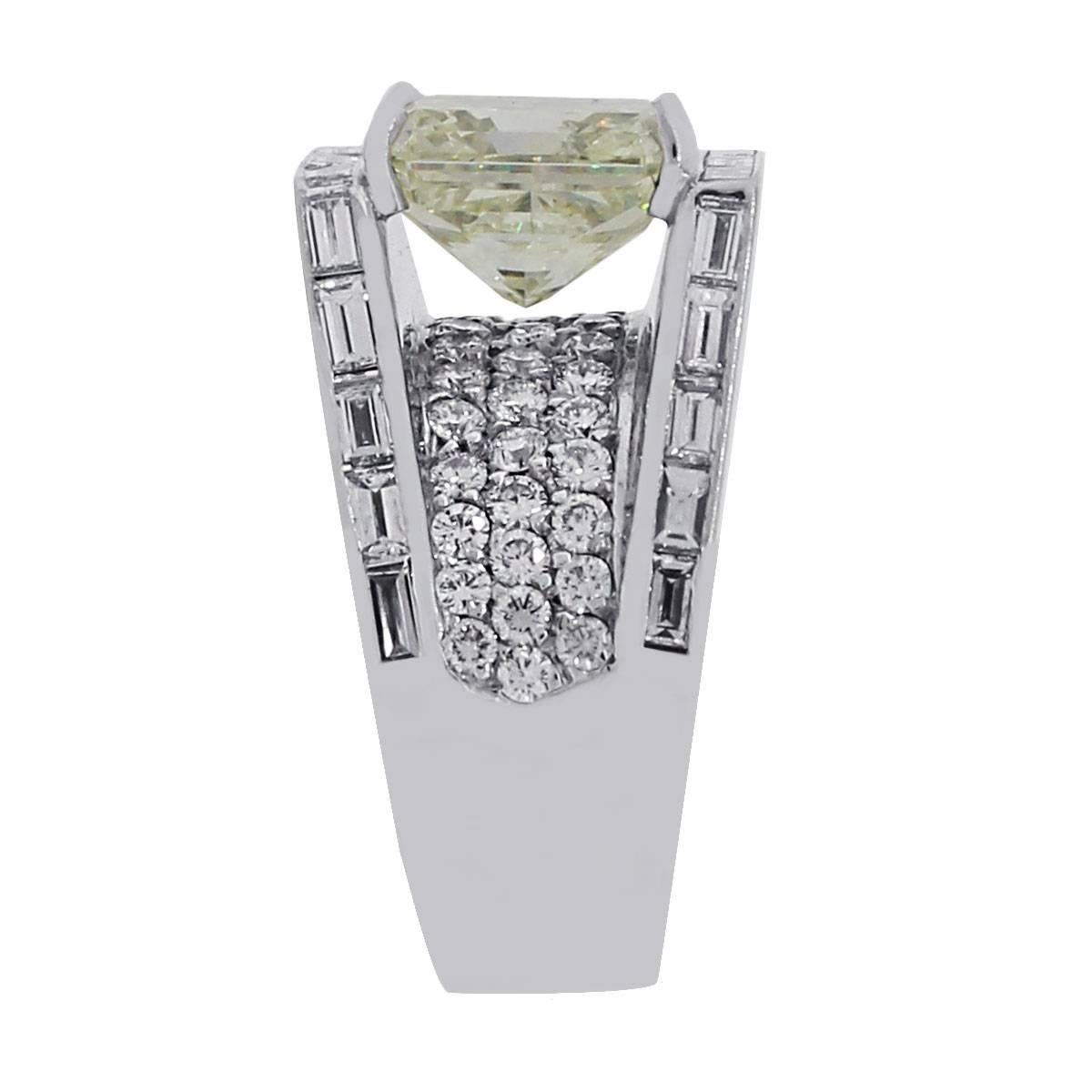 Material: 18k white gold
Diamond Details: Approximately 7.02ct radiant cut diamond, L color and SI3 clarity. Also contains approximately 5ctw of round brilliant and baguette cut diamonds. Diamonds are H/I color and SI2 in clarity.
Size: 9
Total