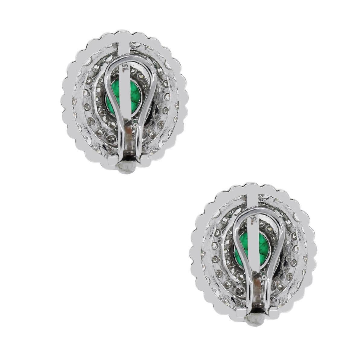 Material: 18k white gold
Diamond Details: Approximately 3.70ctw round brilliant cut diamonds. Diamonds are G/H in color and VS in clarity.
Gemstone Details: Approximately 3.25ctw cabochon emeralds.
Earring backs: Omega backs
Measurements: 0.90″ x