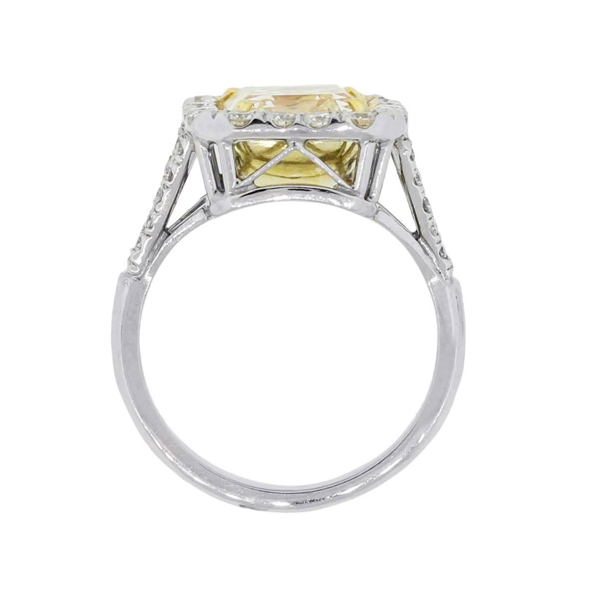 Material: Platinum and 18k yellow gold
Diamond Details: Approximately 5.02ct EGL certified natural fancy yellow emerald cut diamond. Diamond is fancy yellow in color and VS2 in clarity
Other Diamond Details: Approximately 0.74ctw of round brilliant