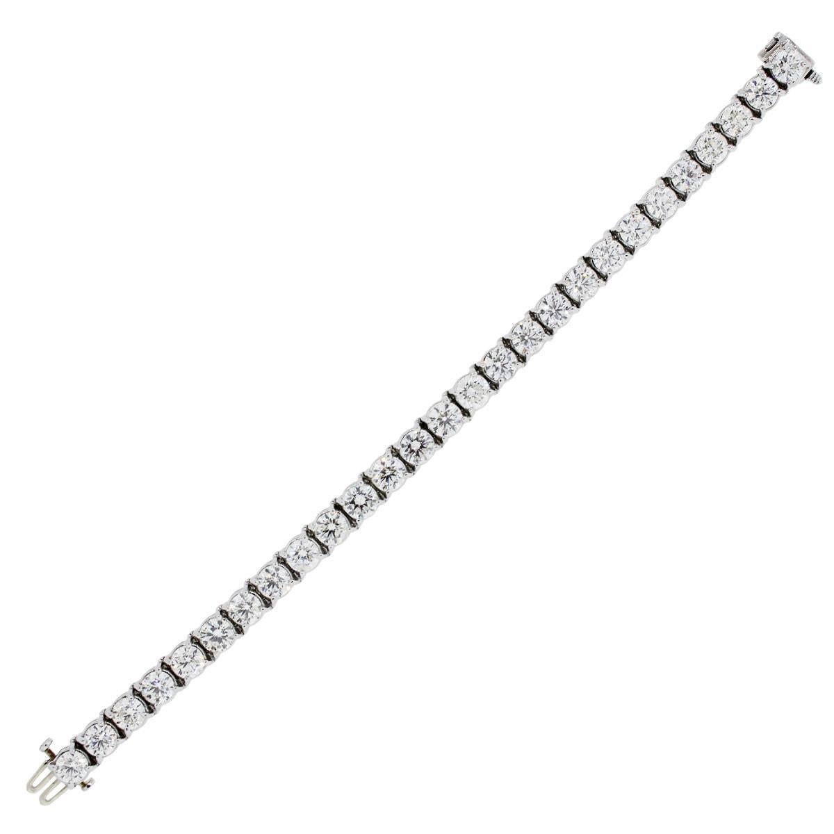 Material: Platinum
Diamond Details: Approximately 19.54ctw round brilliant diamonds. Diamonds are J/K in color and SI in clarity.
Clasp: Double tongue in box clasp with safety latch
Measurements: 7″ x 0.19″ x 0.26″
Total Weight: 39.58g