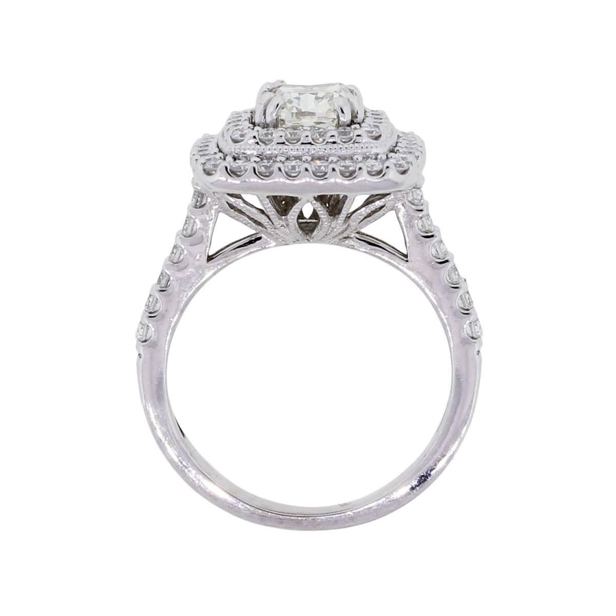 Material: 18k white gold
Diamond Details: Center stone is approximately a 1ct cushion cut diamond. Cushion cut is I/J in color and SI in clarity. Approximately 1ctw of round brilliant diamonds. Round brilliant diamonds are G/H in color and VS in