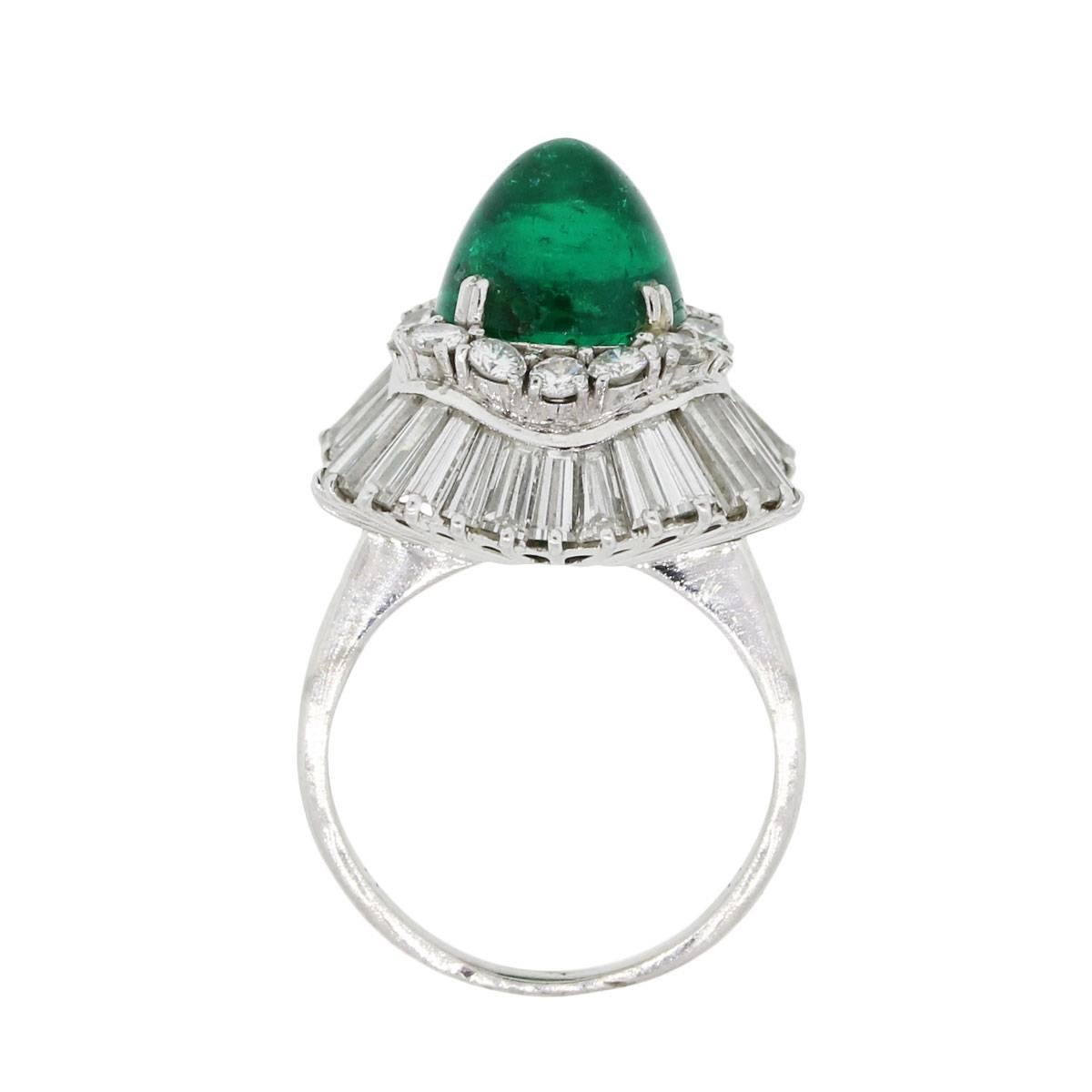 Style: Ballerina Cocktail Ring
Diamond Details: Approximately 2ctw of round brilliant and baguette shape diamonds. Diamonds are G/H in color and VS in clarity
Gemstone Details: Elongated cabochon emerald measuring approximately 10mm x 8mm
Ring Size: