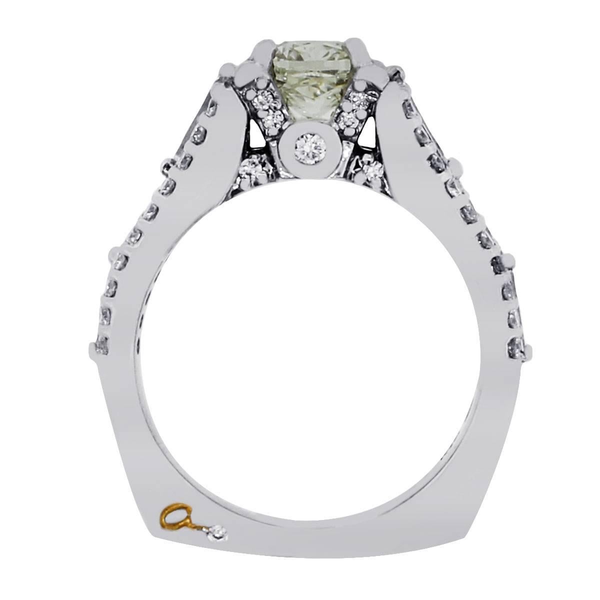 Brand: A. Jaffe
Material: Platinum
Center Diamond Details: Approximately 1ct cushion cut diamond. Diamond is I-J in color and SI in clarity.
Diamond Details: Approximately 1.50ctw of accent diamonds. Diamonds are G/H in color and VS in clarity.
Ring