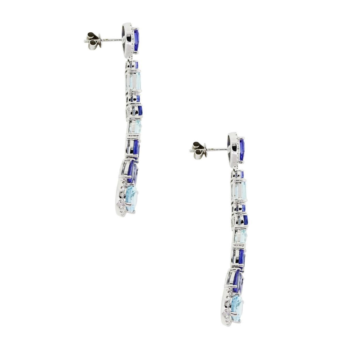 Material: 18k white gold
Diamond Details: Approximately 0.47ctw of round brilliant diamonds. Diamonds are G/H in color and VS in clarity
Gemstone Details: Approximately 4.32ctw of pear and oval shape tanzanites and 2.69ctw of oval and emerald shape