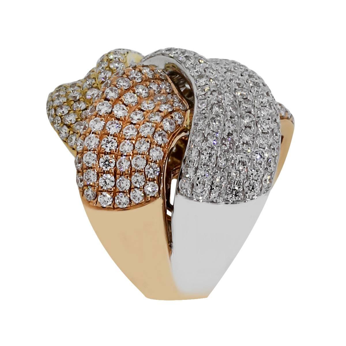 Material: 18k white gold, 18k yellow gold and 18k rose gold
Diamond Details: Approximately 6.38ctw round brilliant diamonds. Diamonds are G/H in color and VS in clarity.
Ring Size: 6.5
Ring Measurements: 1″ x 0.95″ x 1″
Total Weight: 25.6g