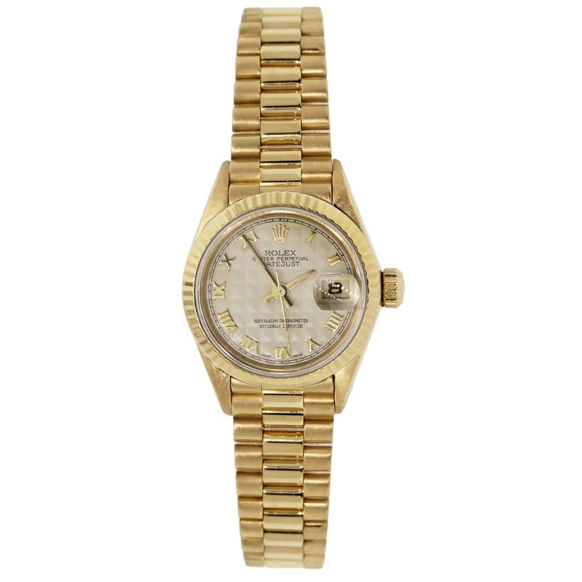 Brand: Rolex
MPN: 69178
Model: Presidential
Serial: “W” serial
Case Material: 18k yellow gold
Case Diameter: 26mm
Crystal: Scratch resistant sapphire
Bezel: 18k yellow gold fluted bezel
Dial: Ivory color pyramid dial with date window at the 3
