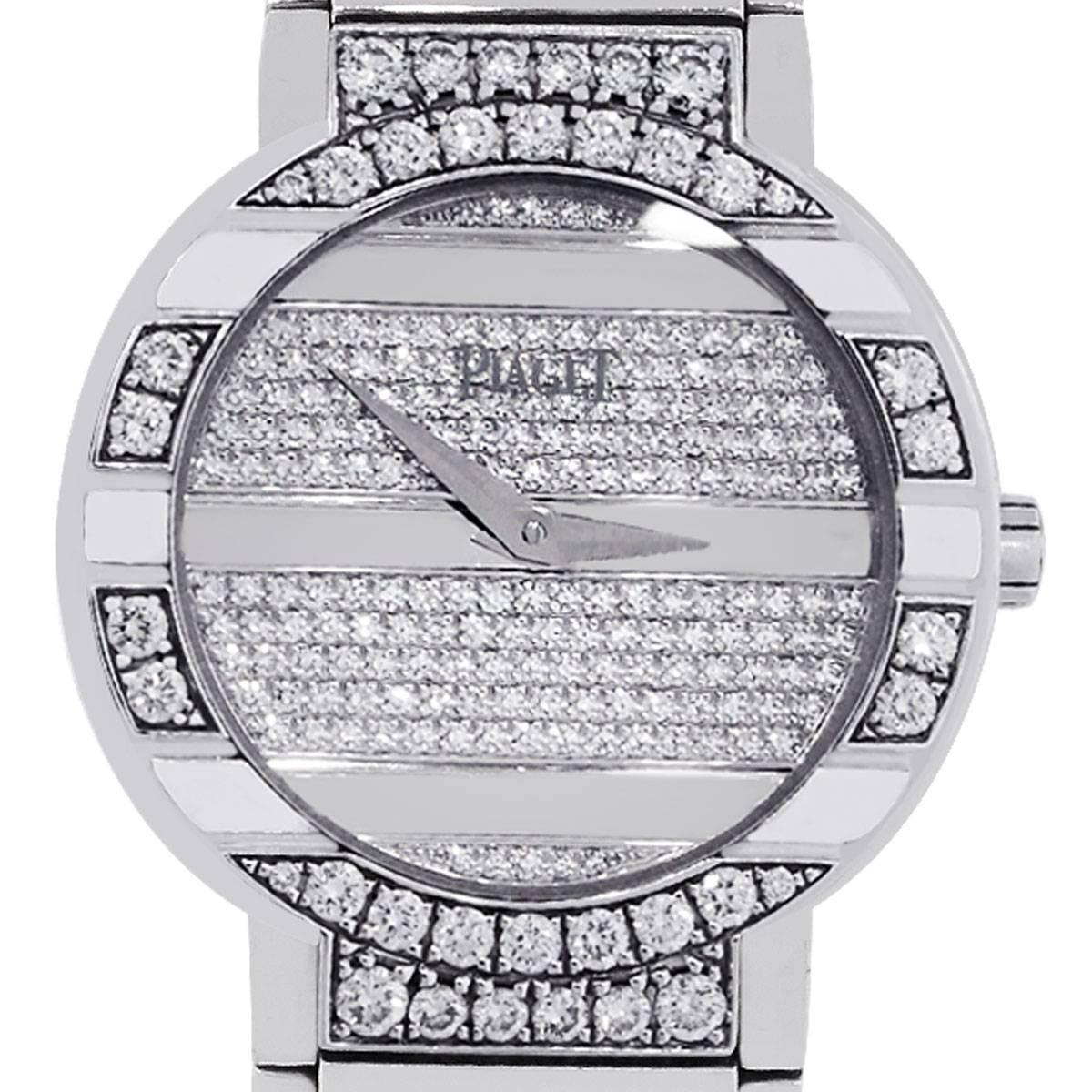 Brand: Piaget Polo
MPN: GOA29038
Case Material: 18k White Gold
Case Diameter: 28mm
Crystal: Sapphire
Bezel: Fixed diamond bezel
Dial: Diamond dial with white gold hour and minute markers. The diamonds on this watch are certified to be D-G in color