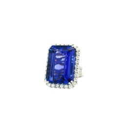 18k White Gold 34.72ct Emerald Cut Tanzanite and 2.26ctw Diamond Halo Ring