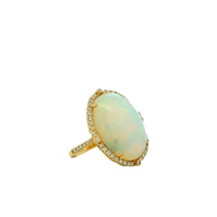 14k Yellow Gold 12.47ct Oval Opal and 0.66ctw Diamond Halo Cocktail Ring