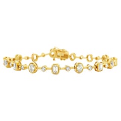 Bracelet « tennis » en or jaune 14 carats, serti de diamants de 3,58 carats au total, taille mixte