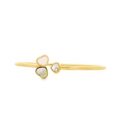 Pulsera tipo brazalete Chopard Happy Hearts de oro amarillo de 18 quilates con nácar