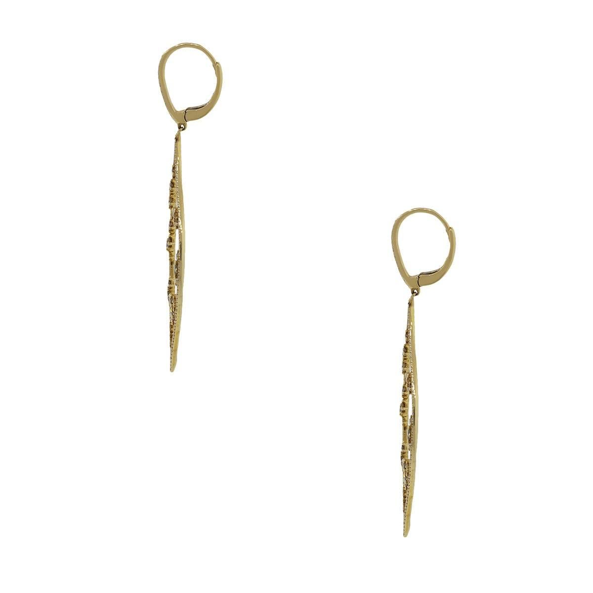 Style: Dangle earrings
Material: 18k yellow gold
Diamond Details: Approximately 1.84ctw warm champagne diamonds. The diamonds on these earrings are G/H in color and VS in clarity.
Earring Measurements: 2.50″ x 0.10″ x 0.95″
Fastening: Lever