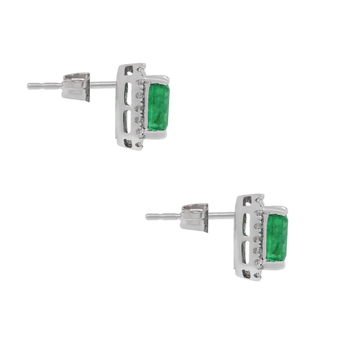 Style: Halo Stud Earrings
Material: 14k White Gold
Gemstone Details: Approximately 1.13ctw emeralds
Diamond Details: Approximately 0.21ctw of Round brilliant diamonds, diamonds are G/H in color and SI in clarity.
Earring Measurements: 14.73mm x