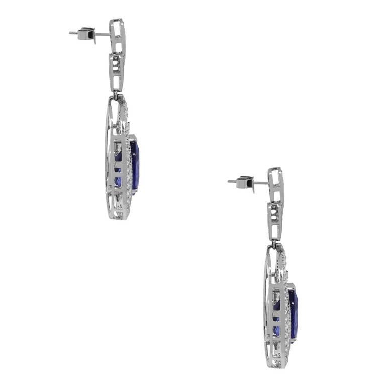 Material: 8k white gold
Gemstone Detail: Approximately 20.37ctw pear shape tanzanite gemstones.
Diamond Details: Approximately 11.50ctw round brilliant diamonds. Diamonds are G/H in color and VS in clarity.
Earrings Measurements: 0.80″ x 0.30″ x