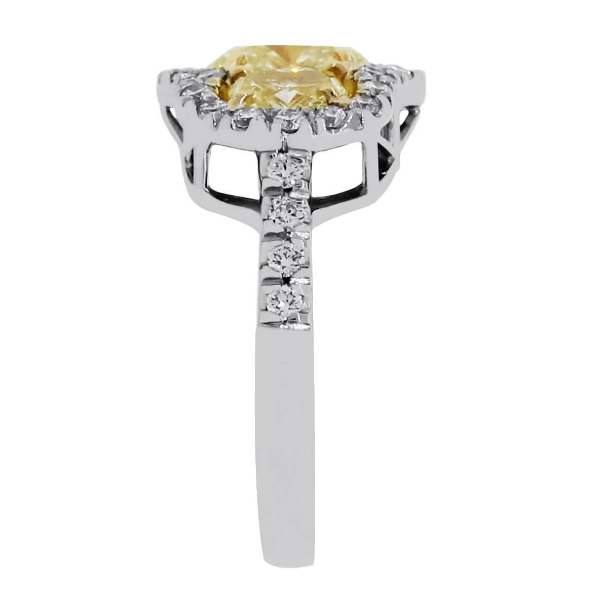 Material: 18k white gold
Diamond Details: Center oval fancy yellow diamond is approximately 1.51ctw, 2 oval yellow diamonds approximately 0.99ctw, and approximately 0.64ctw round brilliant diamonds. White diamonds are G/H in color and VS in clarity.