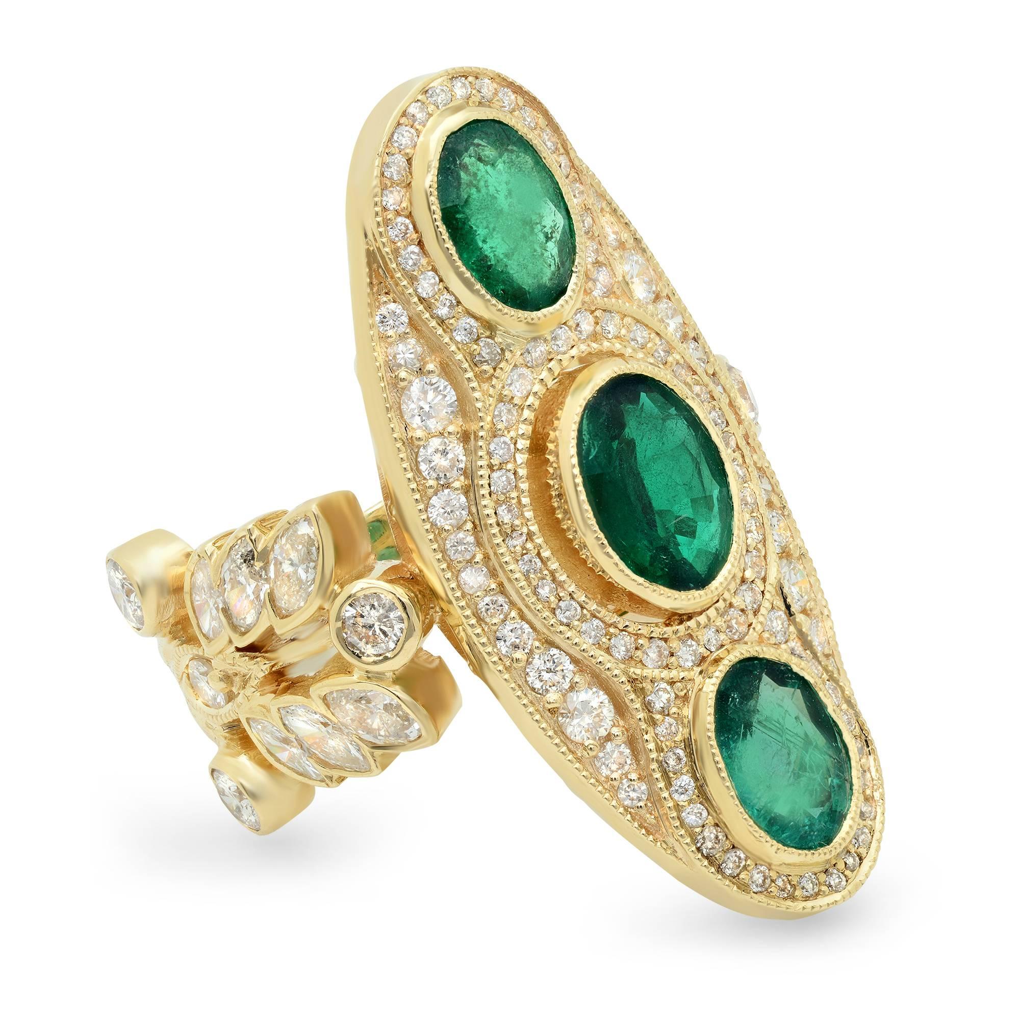 The Majeste Ring includes 3 carats of emeralds, the small inclusions in each stone are reflective of emerald's natural beauty, marquise and pavé diamonds, 18k yellow gold. 

This ring is currently a 7 in US women's sizing.  Please allow 1 week for