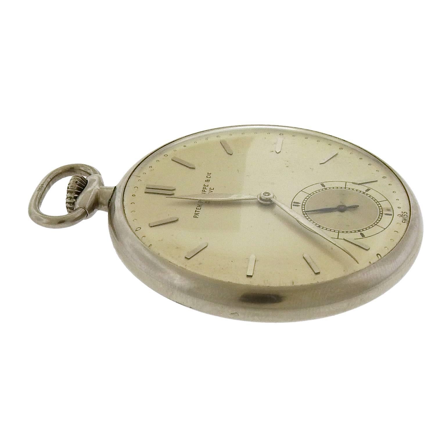 Rare stainless steel Patek Philippe slim open face pocket watch, circa 1935, has a 41mm case, matte silvered dial with two-tone seconds register, applied white gold dart baton hour indexes, white gold leaf hands.  The manual wind movement is