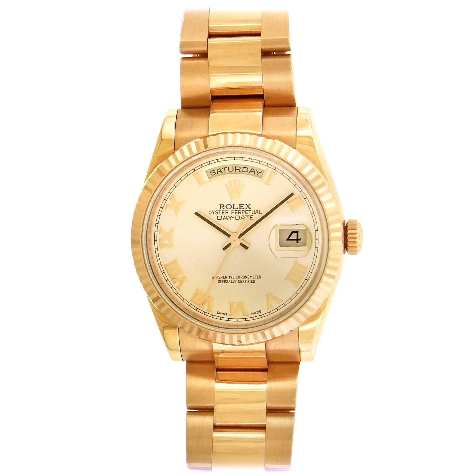 18K rose gold Rolex Day-Date,  Ref. 118235F,made in 2009, is a water-resistant, center seconds, self-winding, 18K pink gold  wristwatch with day, date and an 18K pink gold Rolex President bracelet with concealed deployant clasp, accompanied by