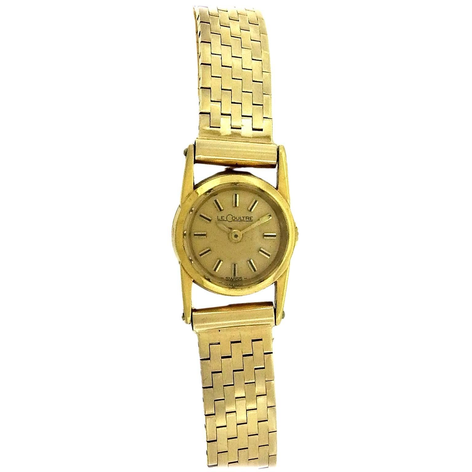 18K yellow gold Jaeger LeCoultre from the 1940's is one of the iconic cocktail watches of the period, this one with a Tiffany hallmarked 14K yellow gold brick pattern bracelet. The 14mm case has extended tapered lugs, and back winder.  The champagne