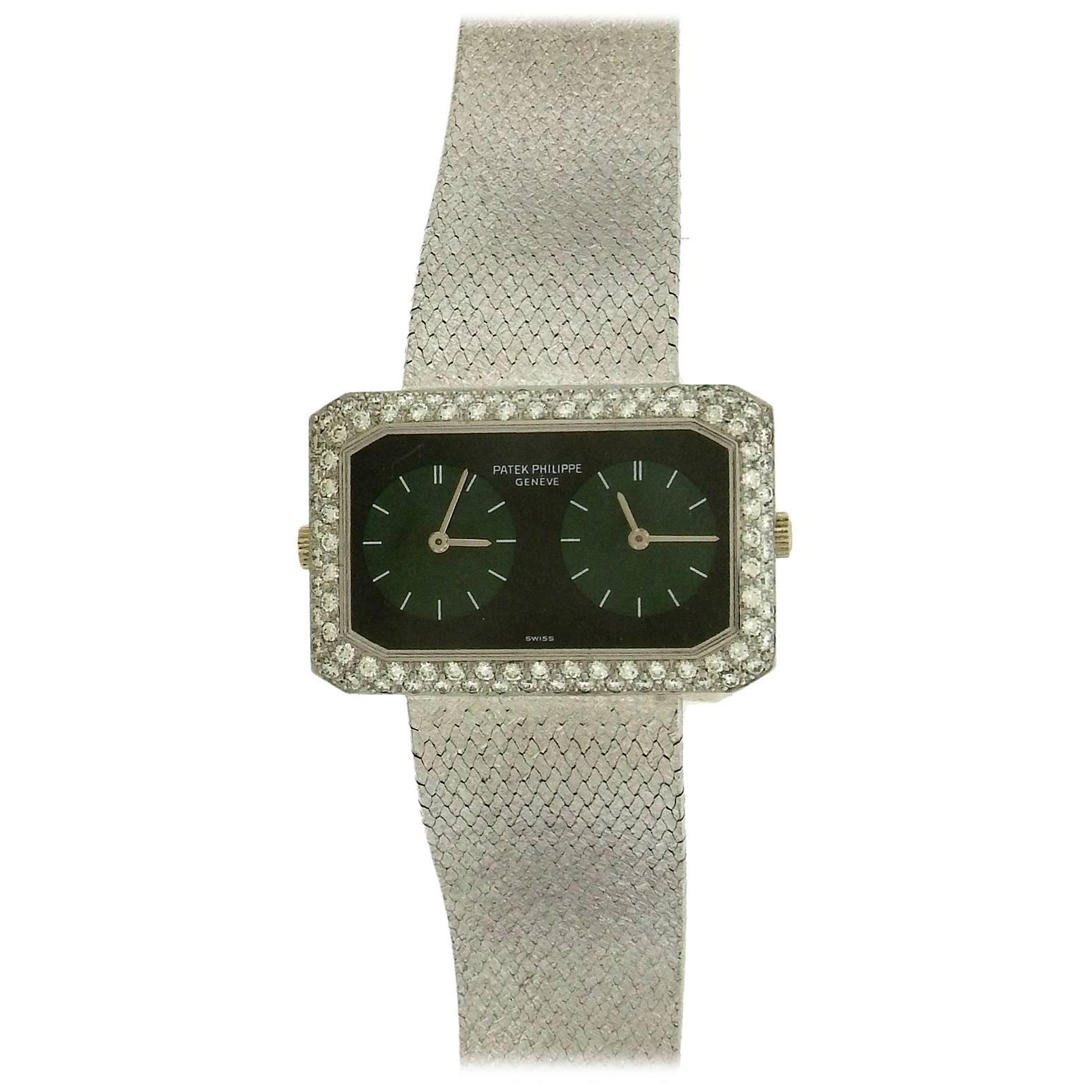 Rare and distinctive, 18K white gold, diamond, jade and onyx, Patek Philippe so-called “Gemini” wristwatch, ref. 4404, circa 1970, is a fine and extremely rare, elongated cut-corner horizontal rectangular two-time zone wristwatch made with two