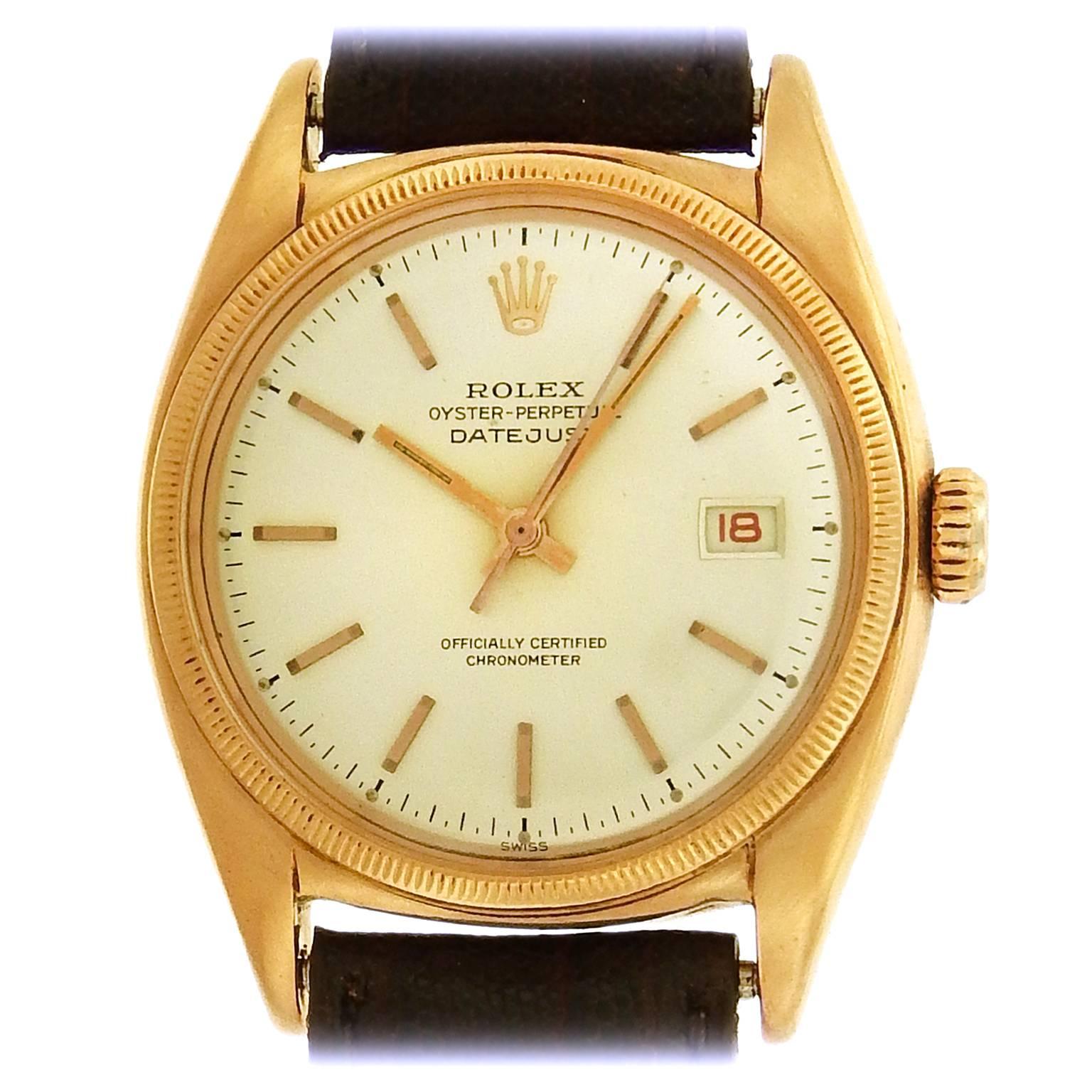 18K rose gold rare Rolex 'Ovettone' Ref. 6031 Datejust, circa 1950's, is a tonneau-shape 35mm automatic bubbleback nicknamed for its 'big egg' shape due to the back.  The silvered dial features applied rose gold baton hour indexes, luminous baton