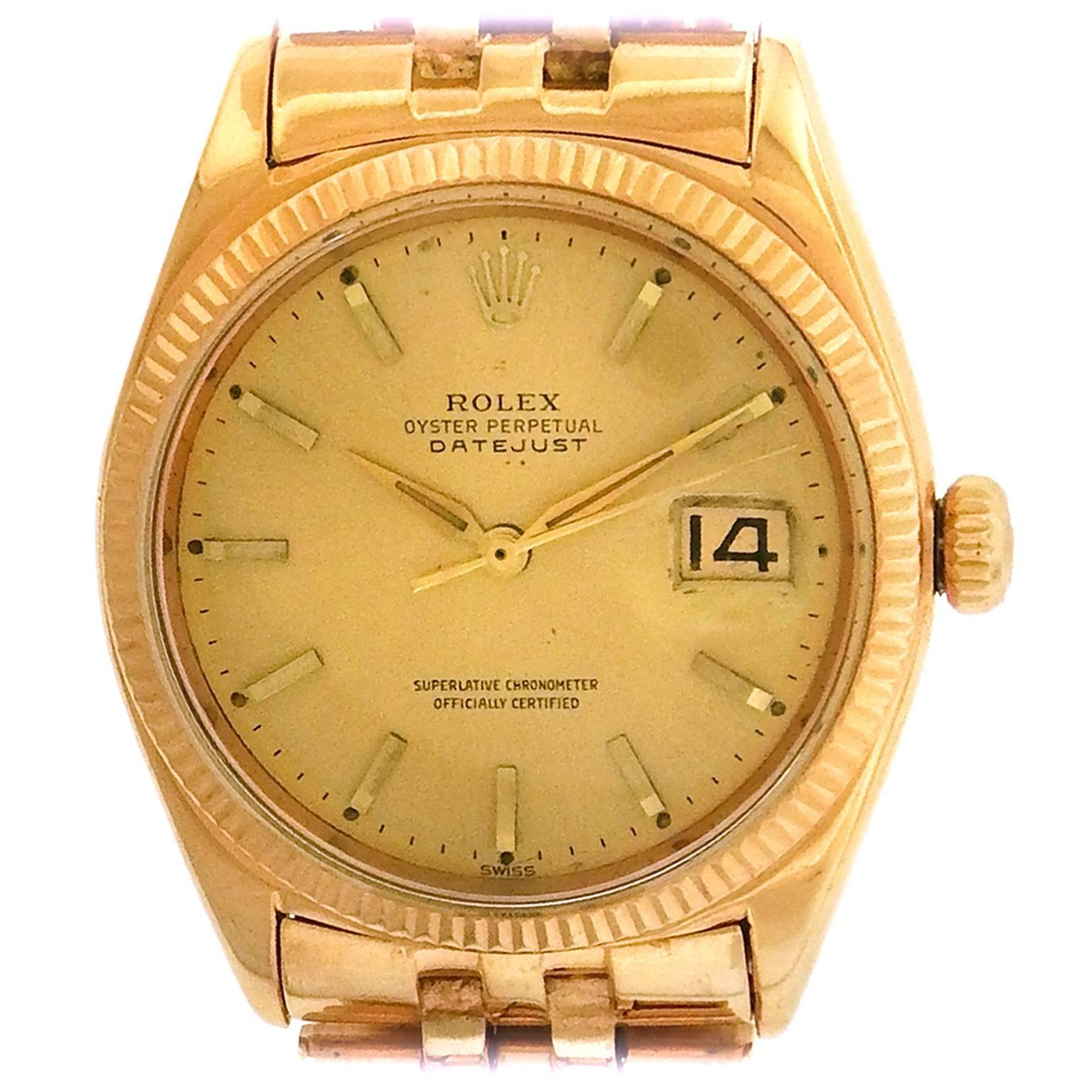 18K rose gold Rolex, Ref. 1601 Datejust circa 1960, is rare vintage Rolex pink gold Datejust with Rolex Jubilee bracelet. The 36mm case has a screwed-down and crown, reeded bezel, and crystal with cyclops lens.  The champagne dial features applied