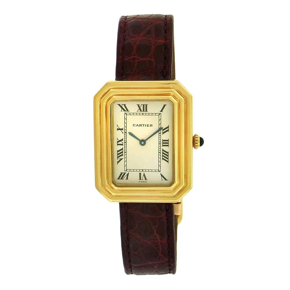 18K yellow gold Cartier Cristallore is a rectangular octagonal wristwatch, circa 1970's, measuring 28mm x 35mm wristwatch with a screwed-down back, triple stepped case, hooded lugs, and Cartier deployant clasp.  The caliber 2512-1, 17 jewel manual