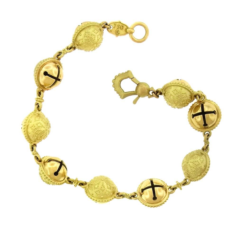 Paul Morelli is known for the meticulous craftsmanship of his collections, including this 18K gold 'Meditation Bells' design, nine 10mm beads with matte finish granulated texture on one side and polished bell on the other. The bracelet is