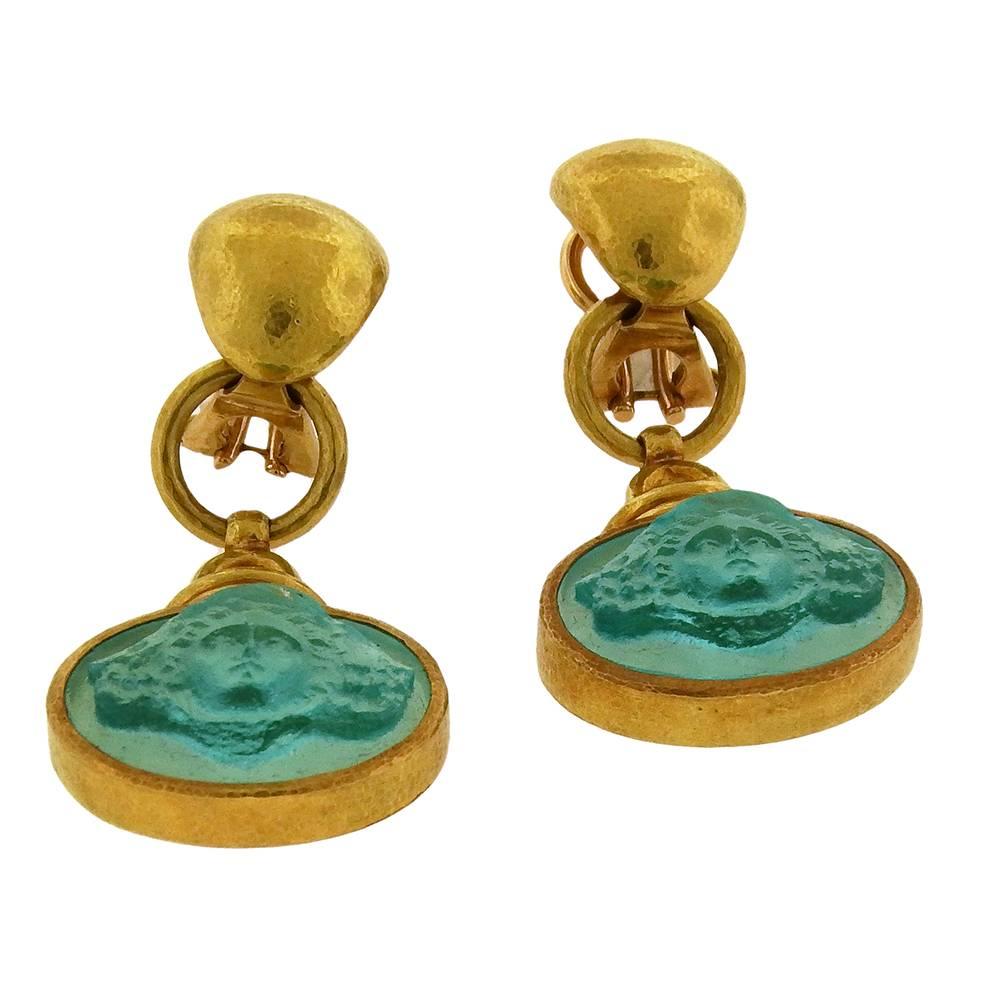 Elizabeth Locke's iconic 19K gold is here hammer-textured at top with an aquamarine blue glass oval intaglio drop. The clip-on earrings measure  7/8