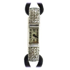 Cartier Ladies Platinum Yellow Gold Diamond Art Deco Wristwatch, circa 1930