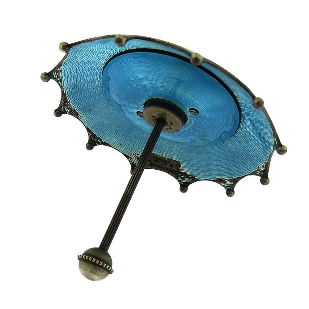 the box is____________________ the umbrella and the clock.
