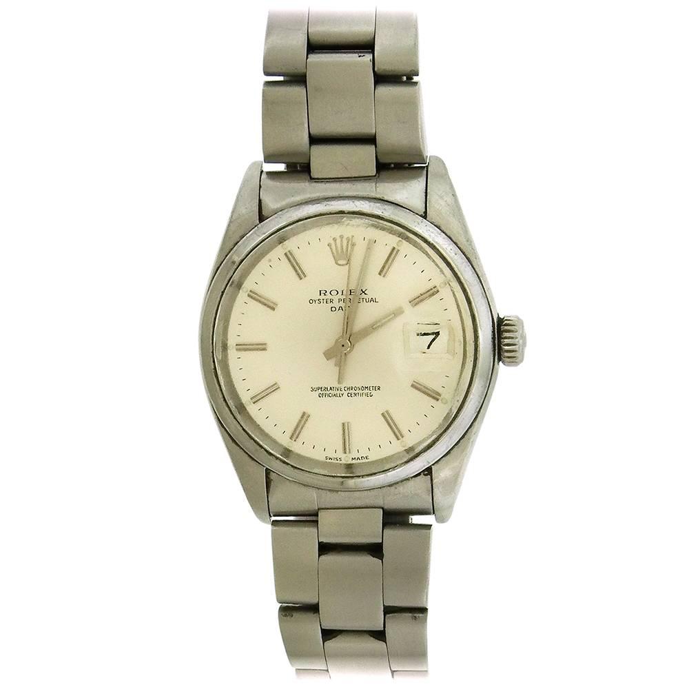 Stainless steel Rolex Oyster Perpetual Date, Ref. 1500, circa 1977, is a center seconds, self-winding, water-resistant, stainless steel chronometer wristwatch with date. The 35mm case has a  screwed-down case back and crown, polished inclined bezel,