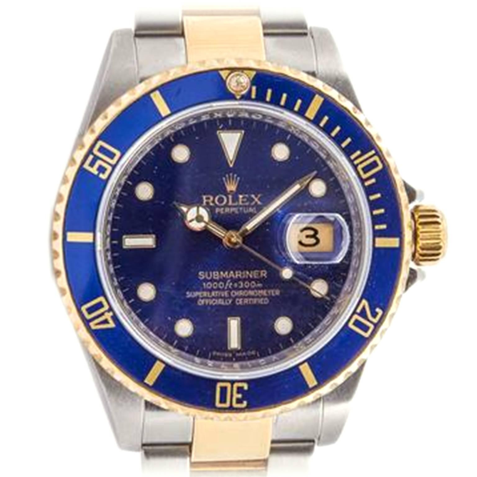 Stainless steel and 18K yellow gold two-tone Rolex Oyster Perpetual Date Submariner, Ref. 16613T, circa 2008, is water-resistant to 1000 feet, self-winding  with date window at 3 o'clock. The 40mm case features a 18K Triplock winding crown protected