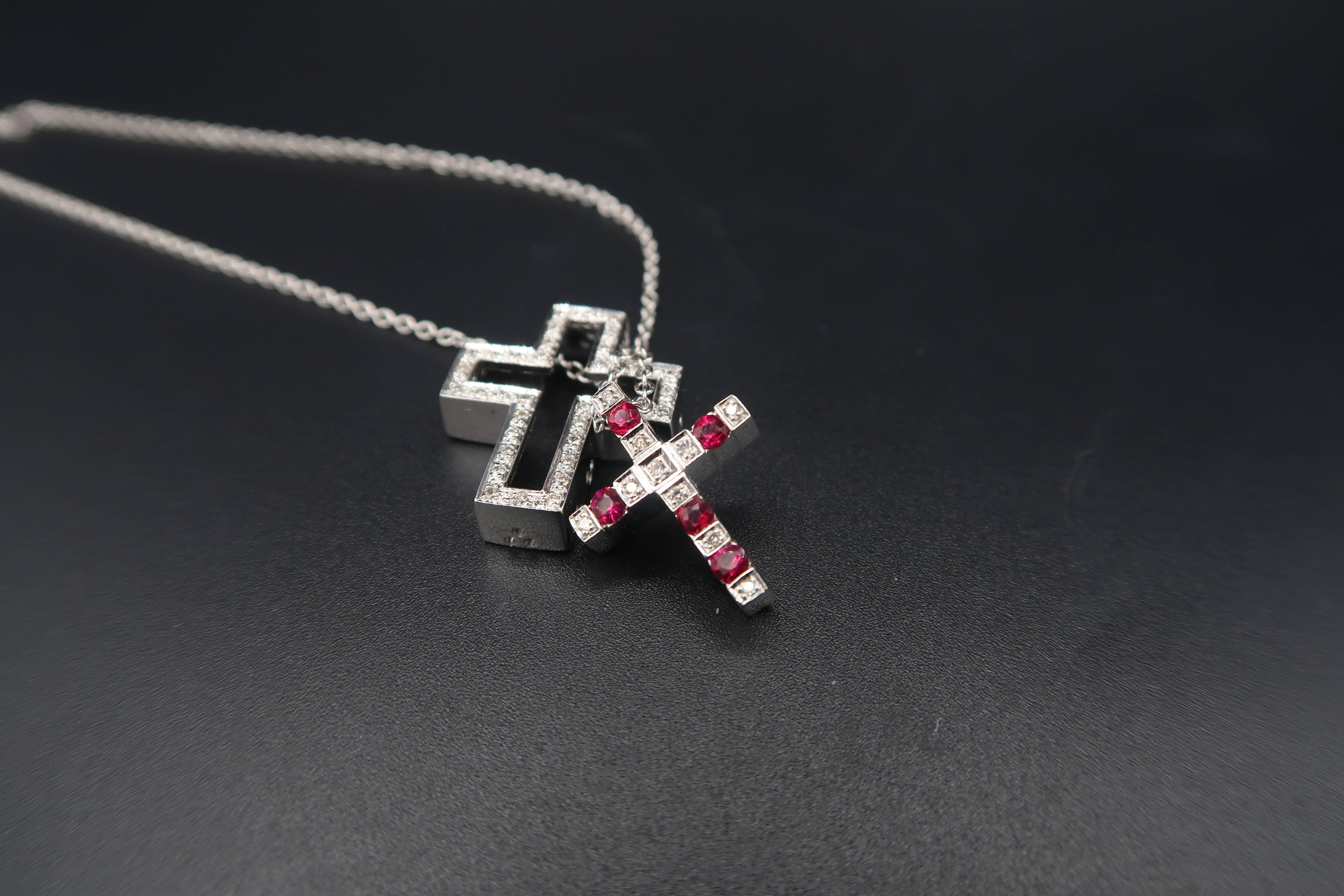 Modern cross pendants that can be combined into one breathtaking cross pendant. Can be worn 3 different ways. Come with a plain 18K white gold chain.

2 Splittable Joinable Cross Pendants
Gold : 8.668g. 18K White Gold
Ruby: 0.50ct.
Diamond : 0.58ct.