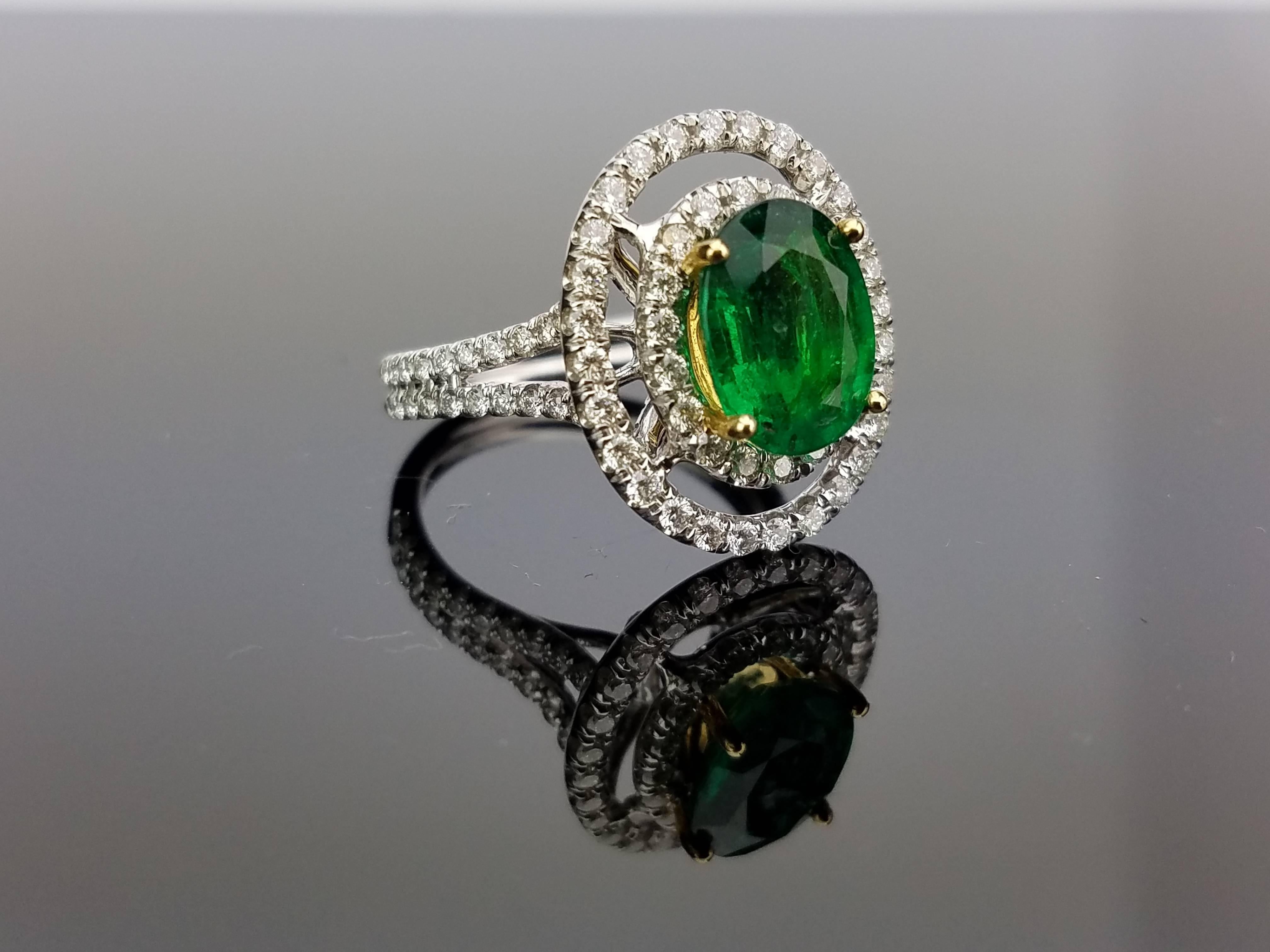 Oval Zambian Emerald Ring with pavé set Diamond on 18K White Gold hoop

Center Stone Details: 
Stone: Emerald
Cut: Oval
Weight: 2.17 carat 

Diamond Details: 
Cut: Brilliant (round)
Total Carat Weight: 0.96 carat 
Quality: VS/SI , H/I 

18K Gold: