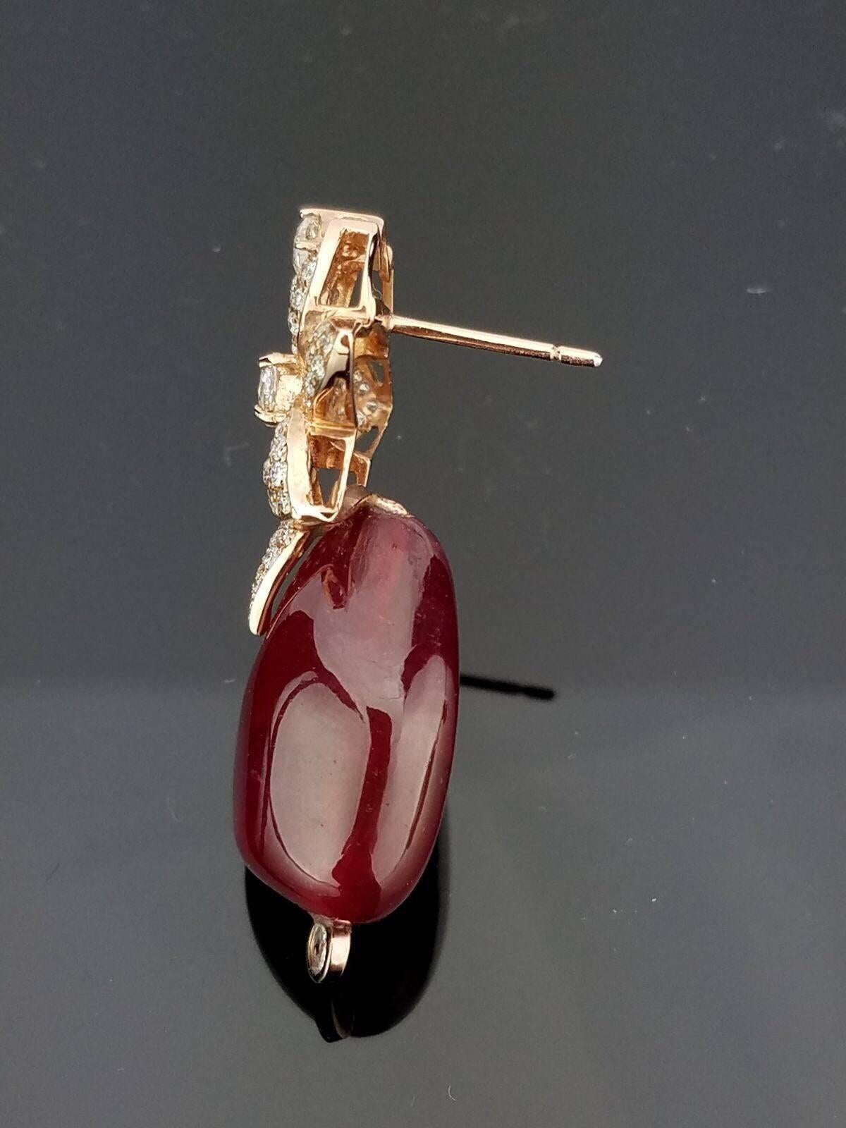 Modern African Ruby Tumble Beads and Rose cut / Brilliant cut diamonds set in 18K Rose Gold, with push

Stone Details:  
Stone: African Ruby
Cut: Tumble Beads
Weight: 77.32 carat

Diamond Details:
Cut: Brilliant (round) / Rose cut (round)
Total