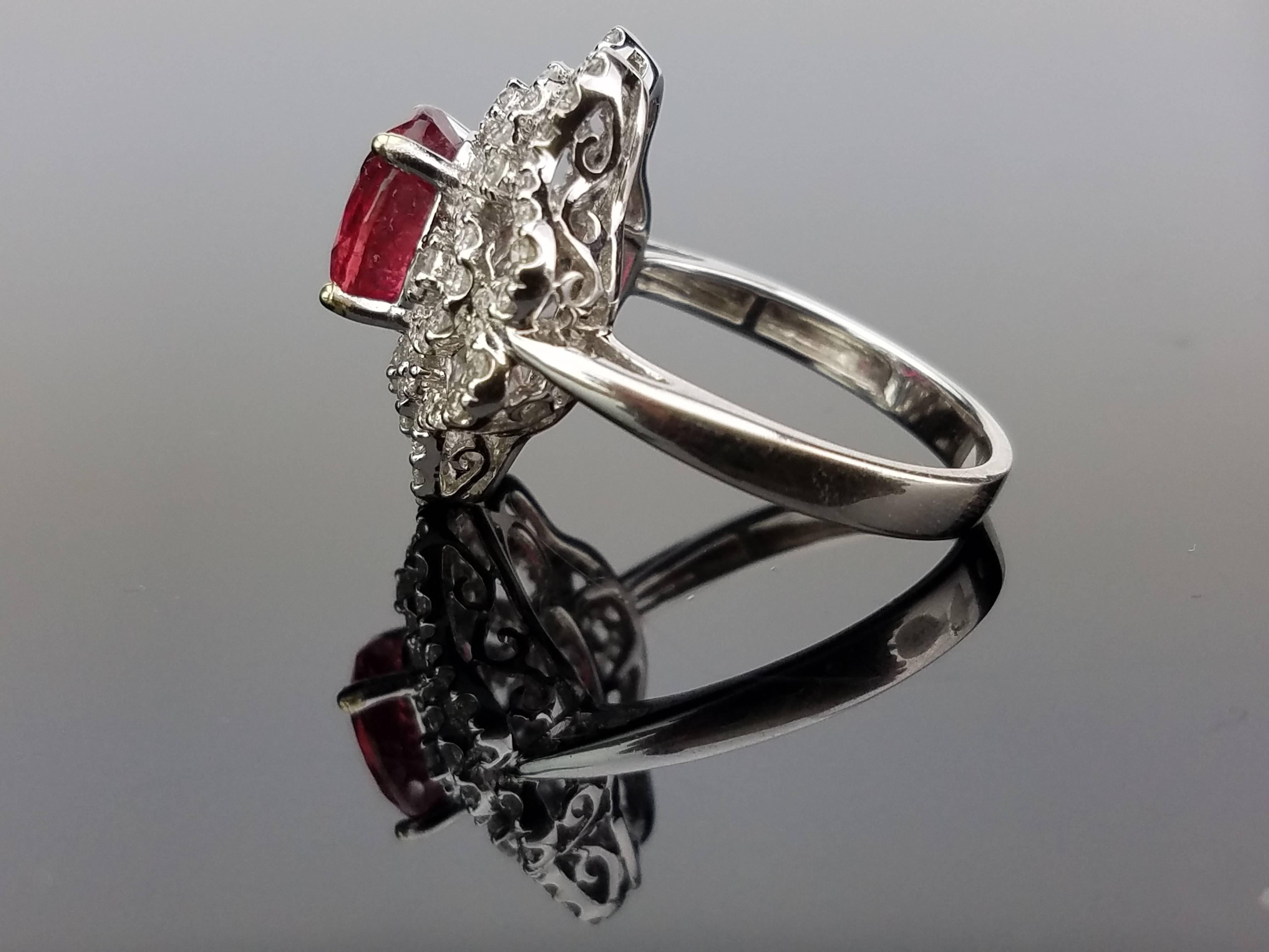 Stone Details:  
Stone: Mozambique Ruby
Cut: Oval
Carat Weight: 2.2 carat

Diamond Details:
Cut: Brilliant (round) 
Total Carat Weight: 0.62 carat
Quality: VS/SI , H/I 

18K Gold: 5.92 grams  

We can also sell the stone/mounting separately. 
Can