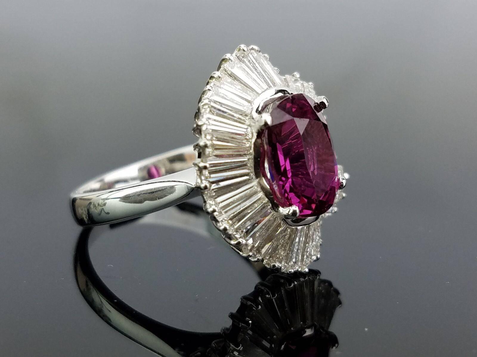 Antique style cocktail ring, with clear Pink Sapphire stone and white Diamonds all set in 18K white Gold. 

Stone Details:  
Stone: Pink Sapphire
Cut: Oval
Carat weight:  3.5 carat (approx)

Diamond Details:
Cut: Baguettes 
Total Carat Weight:  3