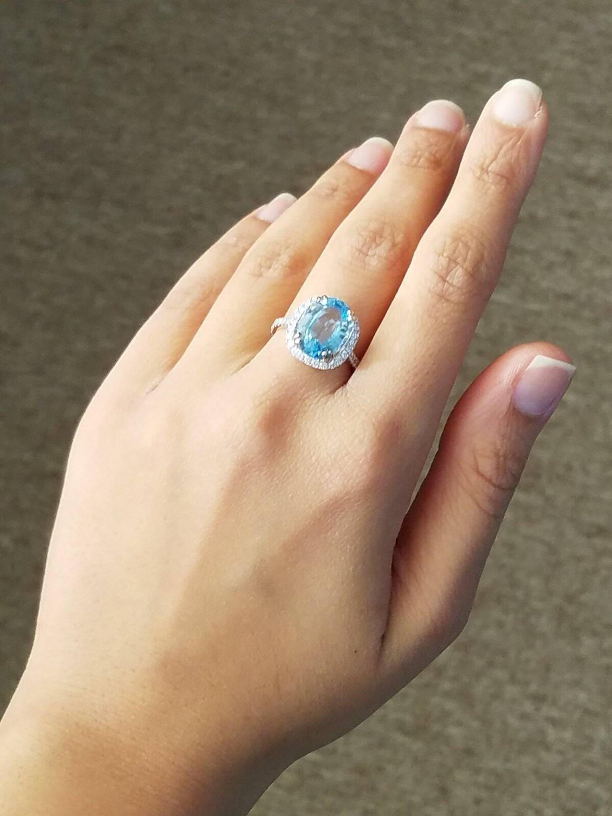 Modern Oval Blue Topaz and Diamond Cocktail Ring For Sale